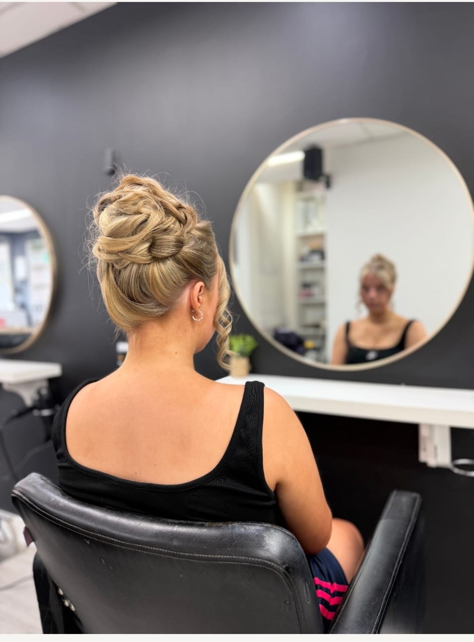 Textured high bun updo in the salon chair — Head Quarters Hair Salon, Longford
